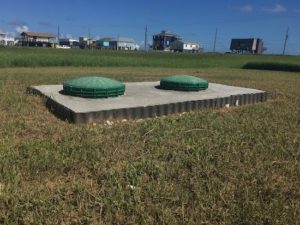 This root barrier stops grass roots from entering the septic tank.